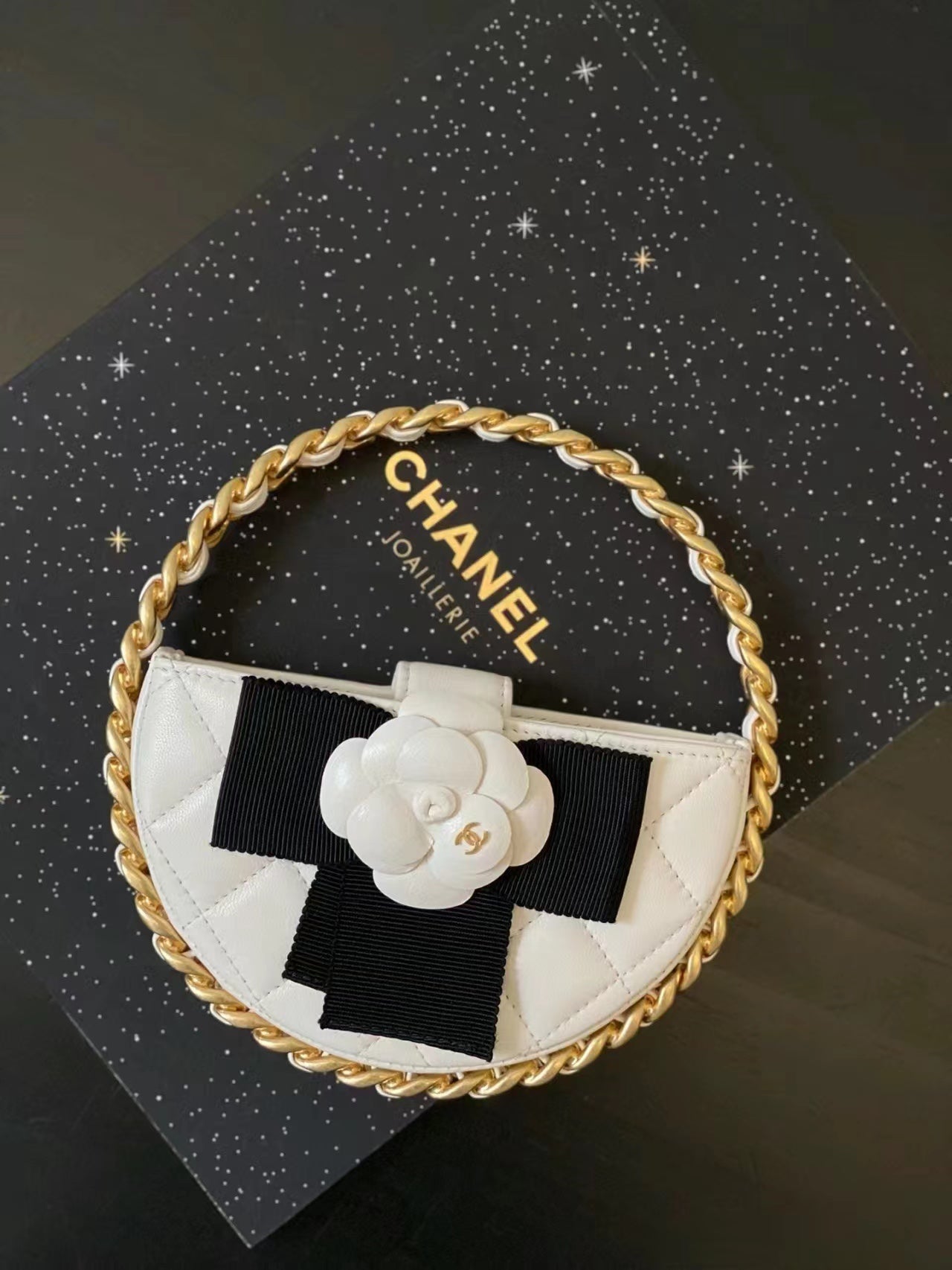 Chanel 2026 Quilted Round Camellia Mini Clutch 16cm Lambskin
