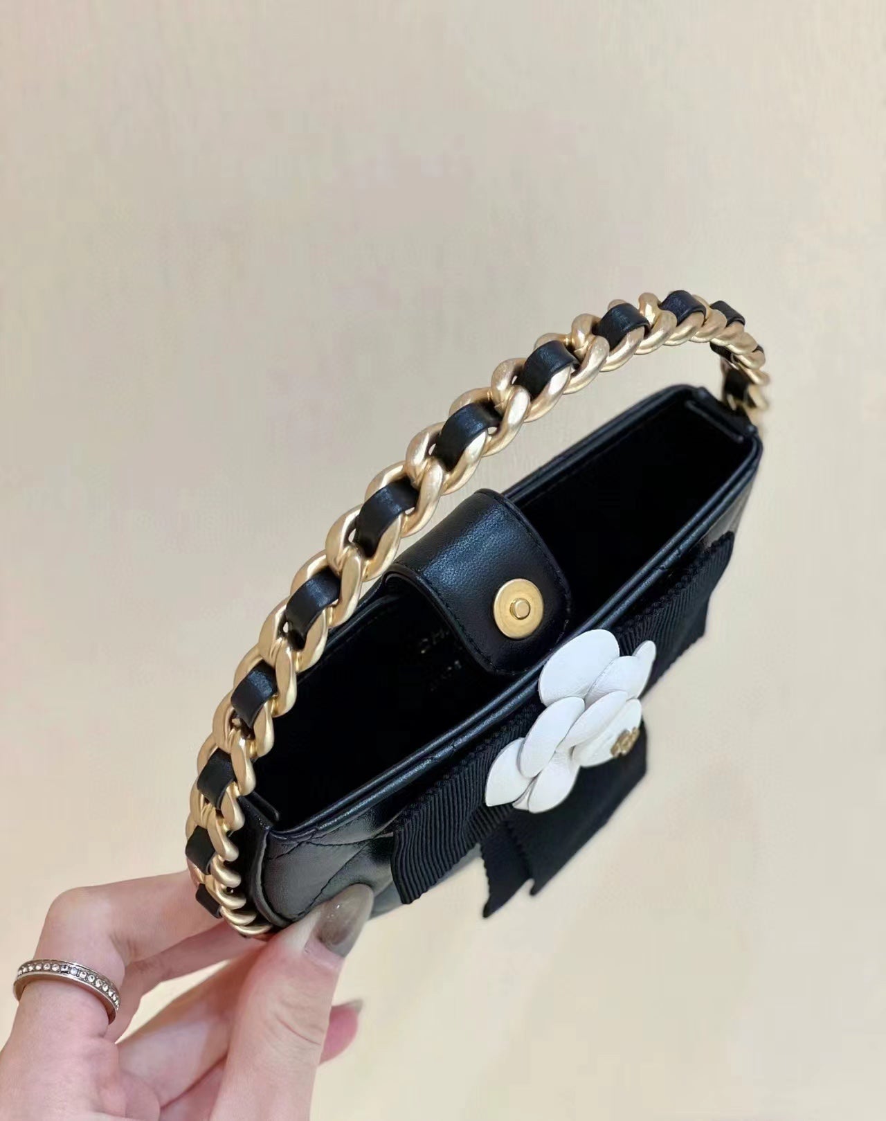 Chanel 2026 Quilted Round Camellia Mini Clutch 16cm Lambskin