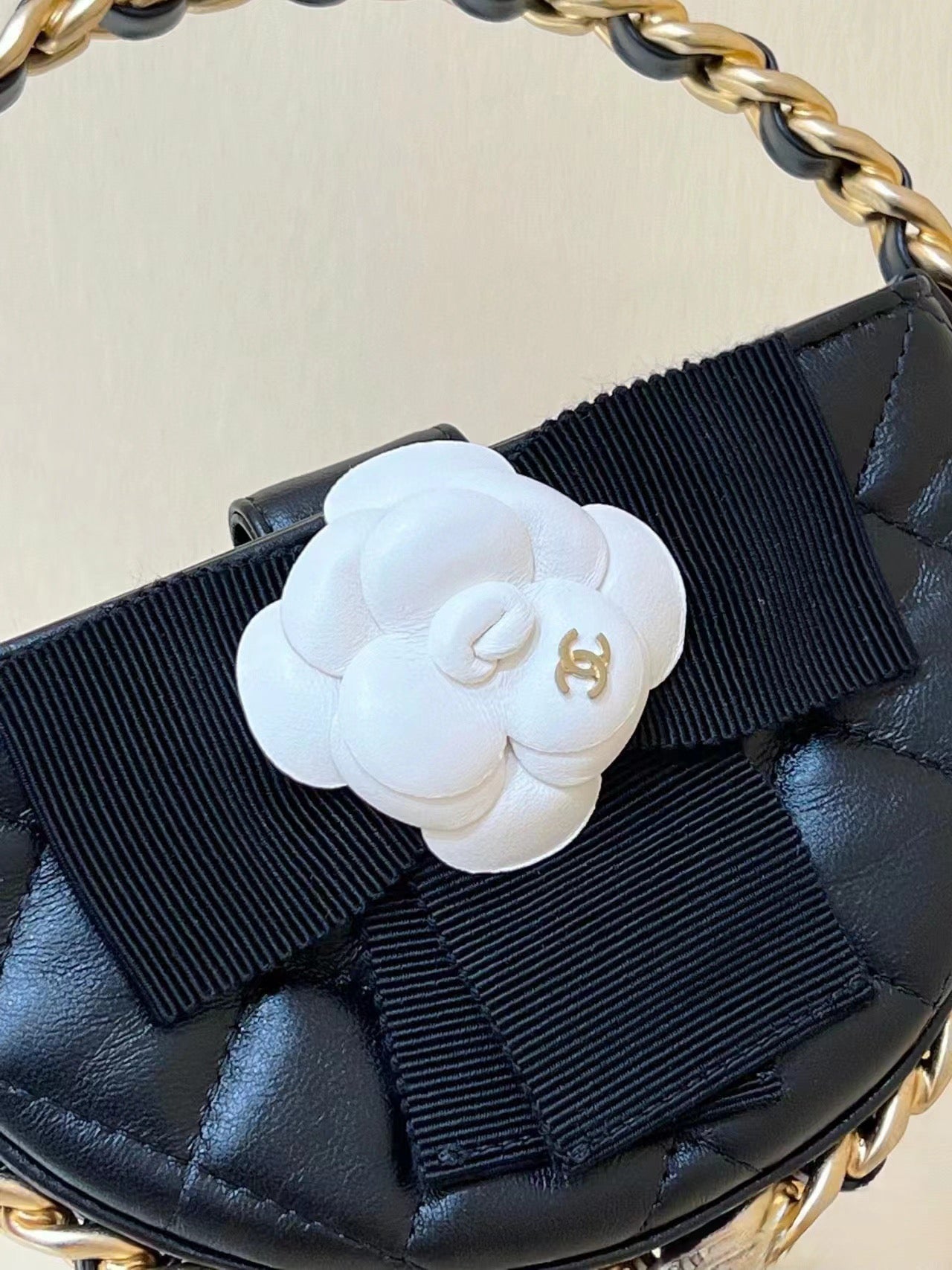 Chanel 2026 Quilted Round Camellia Mini Clutch 16cm Lambskin