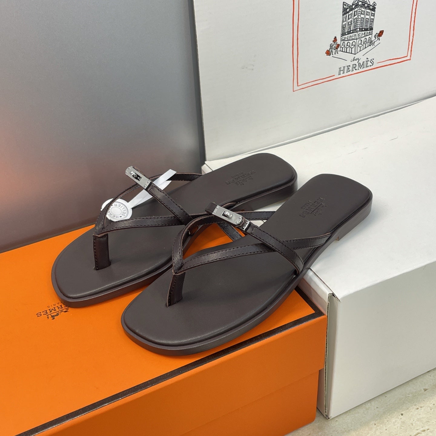 HM 26ss Kelly Sliver Buckle Slipper Black Calfskin 607156